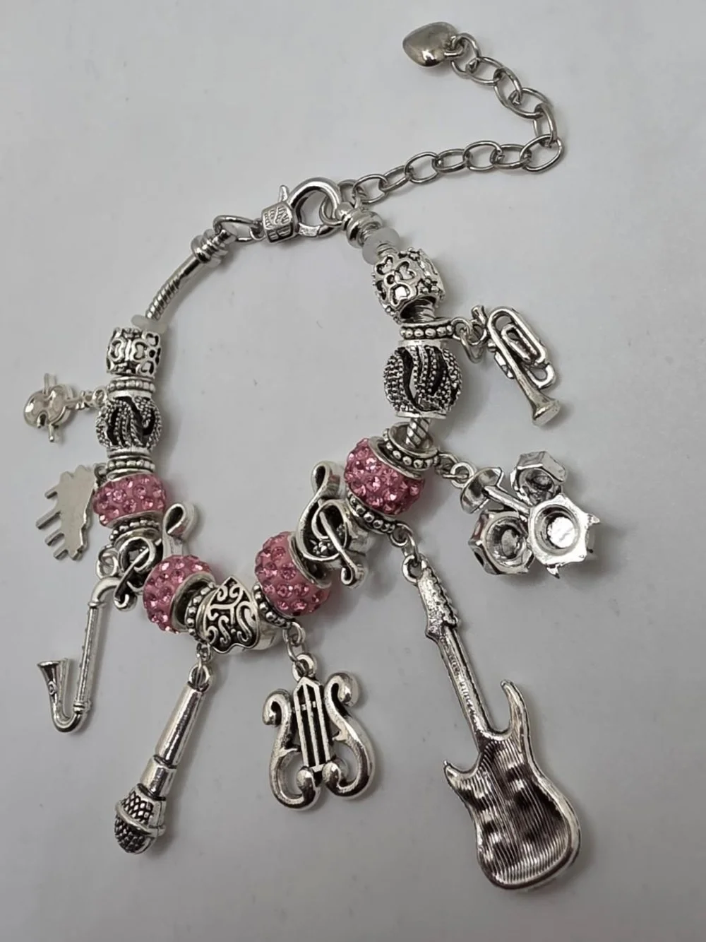 Silver Music Charm Bracelet with Pink Accents